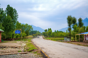 Scenic Road Leading to Pahalgam, Kashmir, India - Lush Green Landscape, Public Convenience, and...