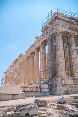 Ancient Parthenon temple under restoration with scaffolding in Acropolis of Athens Greece under...
