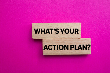 Obraz premium What's your action plan message written on wooden blocks on pink background. Conceptual what's your action plan symbol. Copy space.