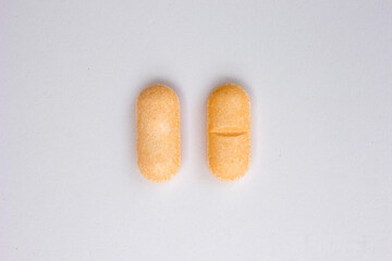 Vitamin C tablets isolated on white background. Vitamin C is a powerful antioxidant that can strengthen your body’s natural defenses.