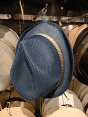 various kinds of cowboy hats in red and black colors sold in the market