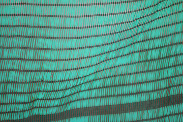 Obraz premium Teal and Black Abstract Texture: A captivating abstract image featuring a teal and black textured fabric, showcasing a unique blend of color and pattern. Ideal for design projects, presentations.
