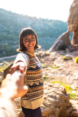 follow me. happy couple traveling. portrait of happy female tourist in mountains. girl smiling. trekking and hiking. girl with backpack.
