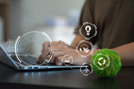 Business man using computer on CO2 emission reduction concept with global warming icon. along with climate, energy, sustainability, environment. - Powered by Adobe