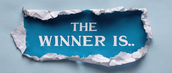 The torn paper reveals an exciting announcement for the winner of a competition.
