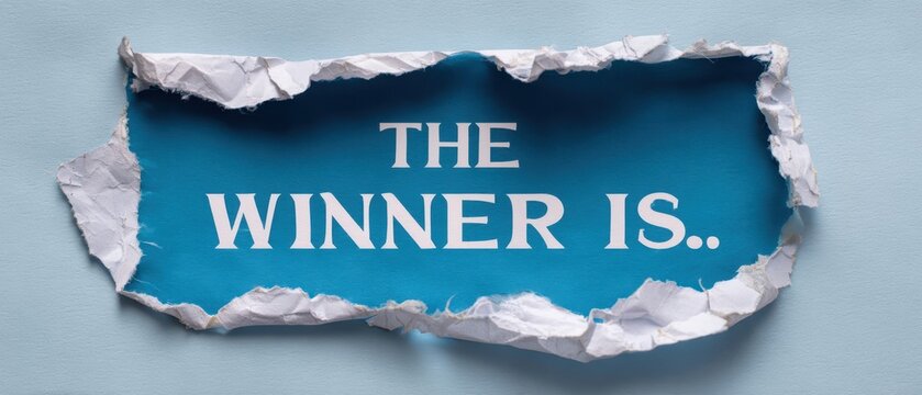 The torn paper reveals an exciting announcement for the winner of a competition.