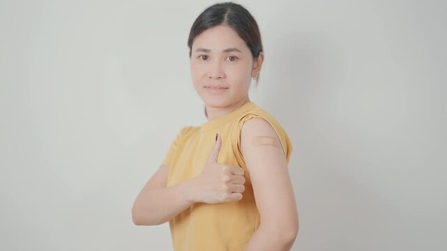 Adult Woman with bandage after received vaccine. Vaccination and Immunization for Influenza, HPV, Zoster, IPD, DTP or Diphtheria, Tetanus and Pertussis, MMR, Hepatitis B, Covid and Varicella vaccine