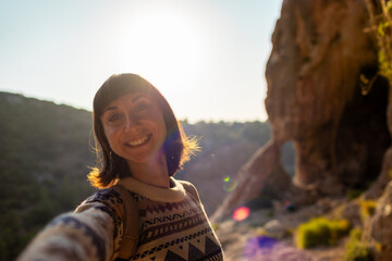 follow me. happy couple traveling. portrait of happy female tourist in mountains. girl smiling. trekking and hiking. girl with backpack.