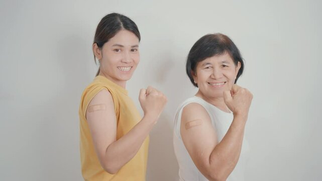 Adult and Elderly Woman with bandage after received vaccine. Vaccination and Immunization for Influenza, HPV, Zoster, IPD, DTP, Dengue, Encephalitis, Rabies, Pneumococcal Hepatitis B and Covid vaccine