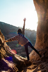 Woman in the mountains. Girl traveling in the mountains. Trekking and hiking. Girl with a backpack.