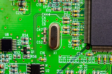 Close-up of a printed circuit board with electronic components, the image symbolizes progress and...