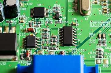 Close-up of a printed circuit board with electronic components, the image symbolizes progress and...