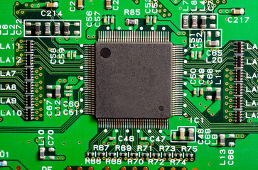 Close-up of a printed circuit board with electronic components, the image symbolizes progress and...