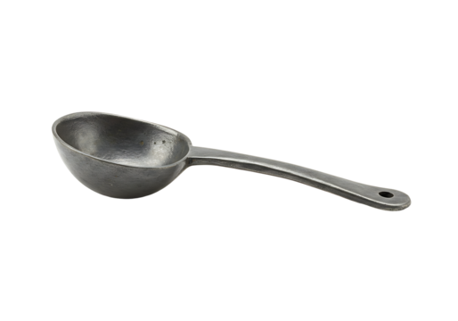 An antique pewter spoon with a long curved handle and a small hole at the handles end sits on a black background
