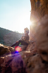 happy woman in mountains. girl traveling in mountains. trekking and hiking. girl with backpack.
