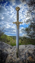 Ornate sword resting on a rocky outcrop.