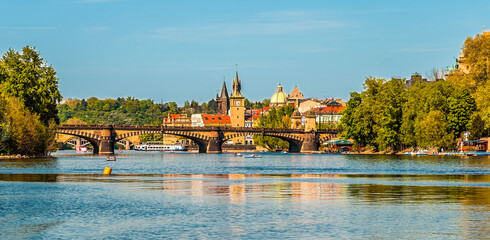 A view from the Vltava river past the Legion Park towards the Legion Bridge in Prague in springtime