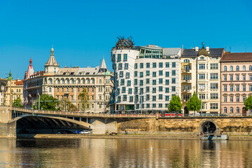 A view from the Vltava river towards the east bank and the Jirasek Bridge in Prague in springtime