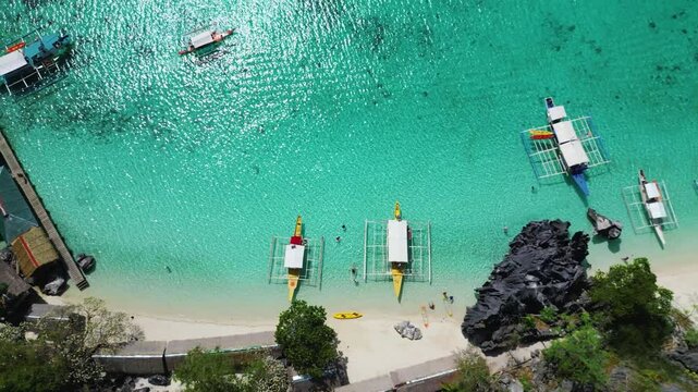 Overhead View of Colorful Bangka Boats Lined on Powder‑White Beach