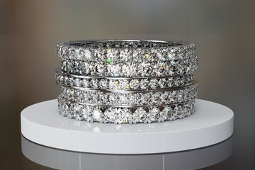 Various eternity diamond rings on white tray on dark background