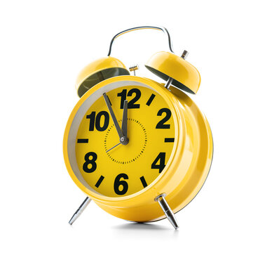 Bright yellow retro alarm clock with twin bells on transparent background. Classic style showing 12:00. Great for time-related designs and wake-up concepts in PNG format.