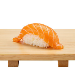 Fresh salmon nigiri sushi on wooden board, close-up view.
