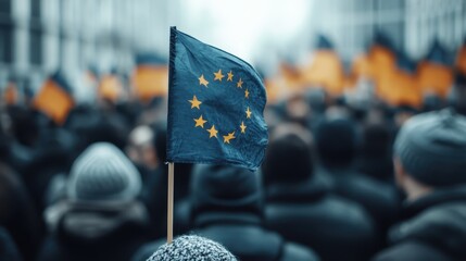 A focused image of an EU flag held high among a bustling crowd, emphasizing unity, democracy, and collective voices advocating for a common cause in contemporary society.