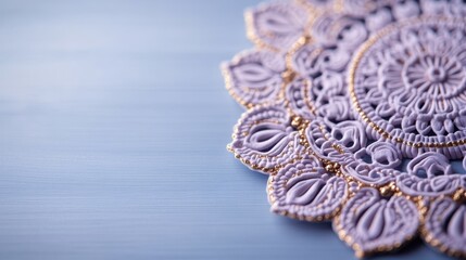 Obraz premium This elegant image features a beautifully crafted lavender lace pattern, showcasing intricate details set against a soft blue background, perfect for artistic projects.