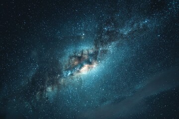 Fototapeta premium A vast dark night sky filled with countless stars and the bright colorful band of the Milky Way galaxy stretching across it