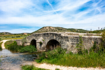 Historic Romanesque Bridge over Esgueva River. Tortoles de Esgueva, Burgos, Castile and Leon, Spain