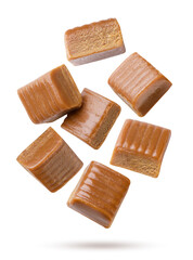 Toffee candies flying on a white background. Isolated