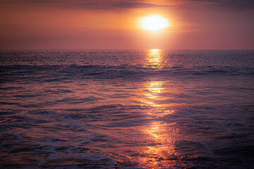 Sunset Over the Pacific Ocean – Warm Light Reflecting on the Water Surface