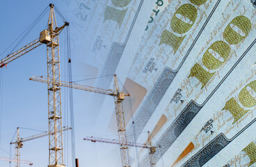 Construction cranes on a background of money. Сoncept of rising and changing construction costs