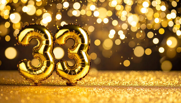 Banner with number 33 golden foil balloon. Anniversary celebration. Golden bokeh.