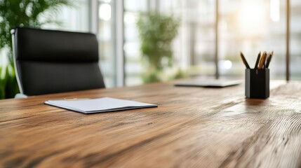 The image showcases a modern office table featuring a minimalist design, with clear lines and natural wood, offering an inspiring and productive workspace filled with light.