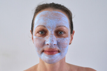 Portrait of woman with healing mask on her face.