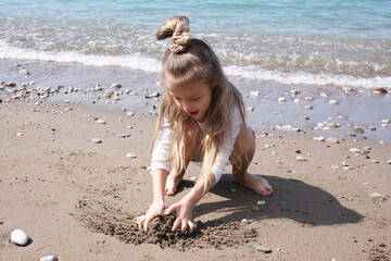 little cute girl on beach, lifestyle people concept