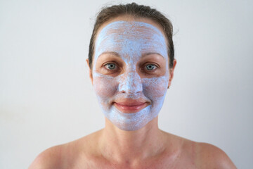 Portrait of woman with healing mask on her face.