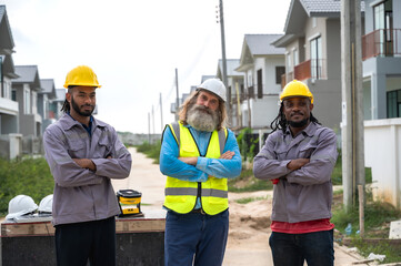 Male diversity site engineer team brainstorming in construction site