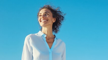 Joyful Woman Smiling Under a Sunny Sky: Embracing Freedom and Happiness. A vibrant portrait capturing a moment of pure bliss and carefree joy.