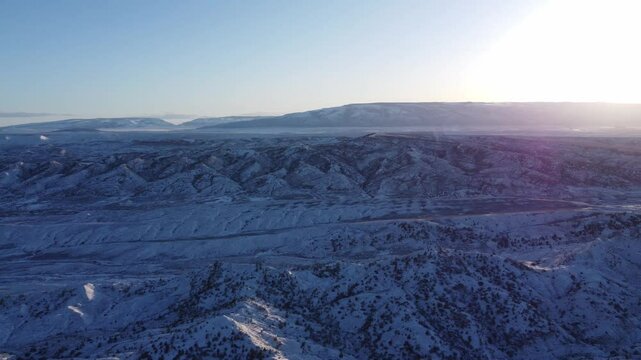 Drone pan across Pryor mountains sunset 
