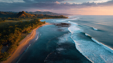 AERIAL: Following a sunset surf session, surfers observe large waves breaking from the shore. magnificent picture of the Pacific Ocean's orange-glow sandy beach. Surf friends visiting the exotic Playa