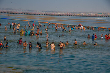 group of people walking on beach
