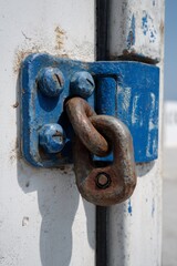 Close-up of an industrial container seal lock against a white backdrop showcasing detailed mechanics