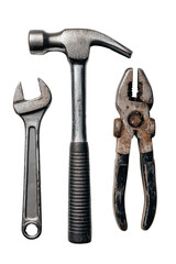 Industrial tools including a wrench, hammer, and pliers arranged on a clean white surface for construction and repair tasks