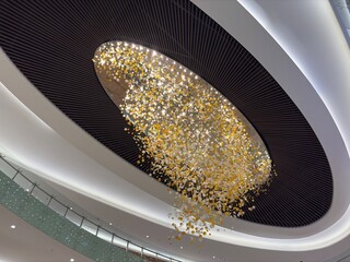 Modern ceiling chandelier with numerous sparkling lights.