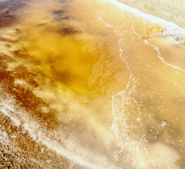 The crust of self-settling salt on the surface of a hypersalted lake looks like thin ice