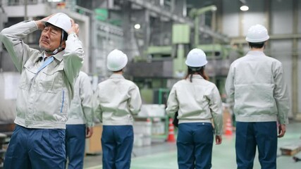 A worker leader is shocked when his subordinates turn their backs on him in a factory