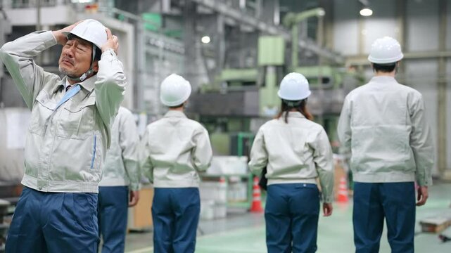 A worker leader is shocked when his subordinates turn their backs on him in a factory