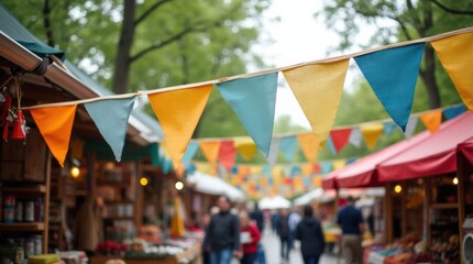 Colorful Triangular Bunting Flags Decorating Festive Outdoor Market with Stalls and People in Daylight